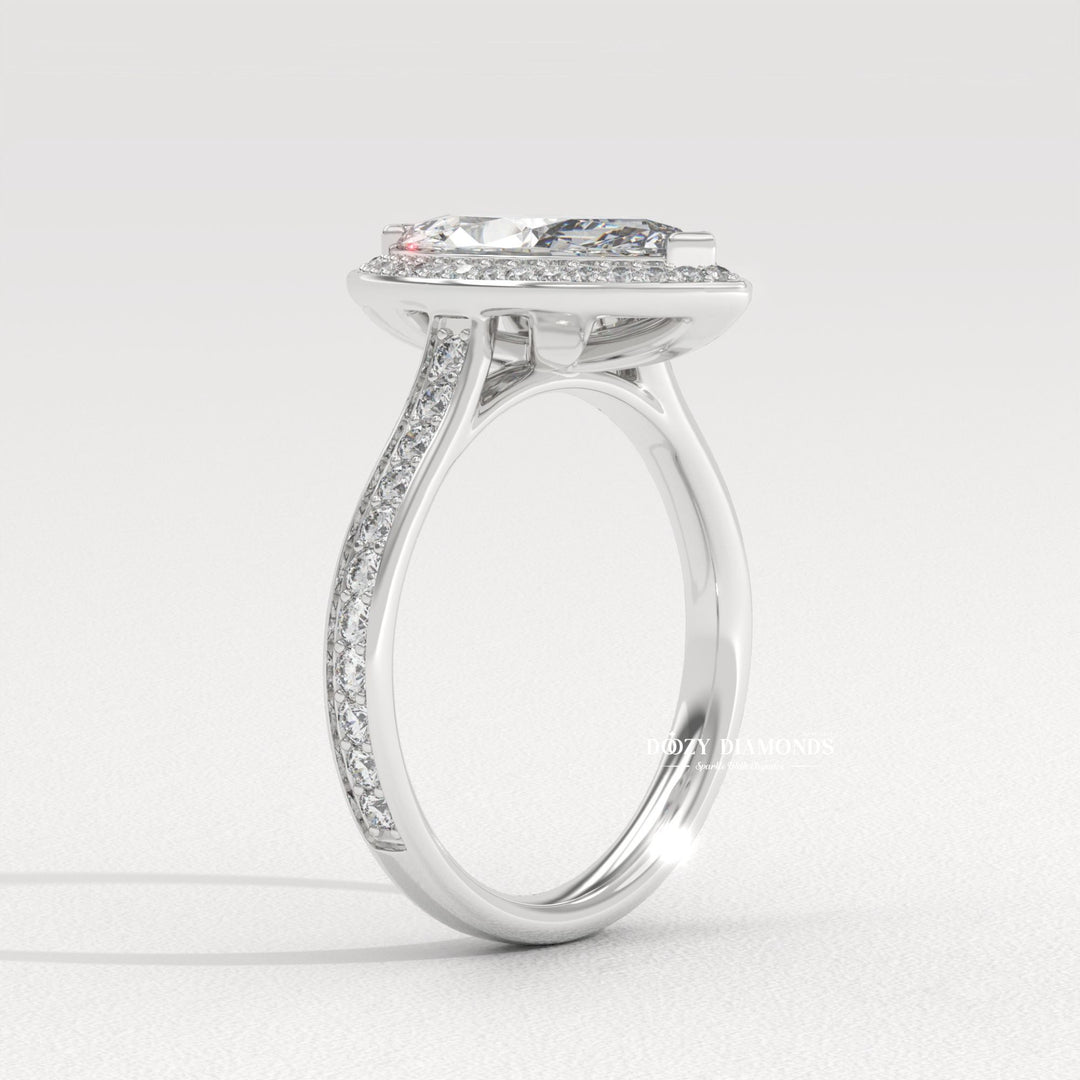 Unique marquise engagement ring
Elegant engagement ring
Diamond halo setting
Channel setting diamond ring