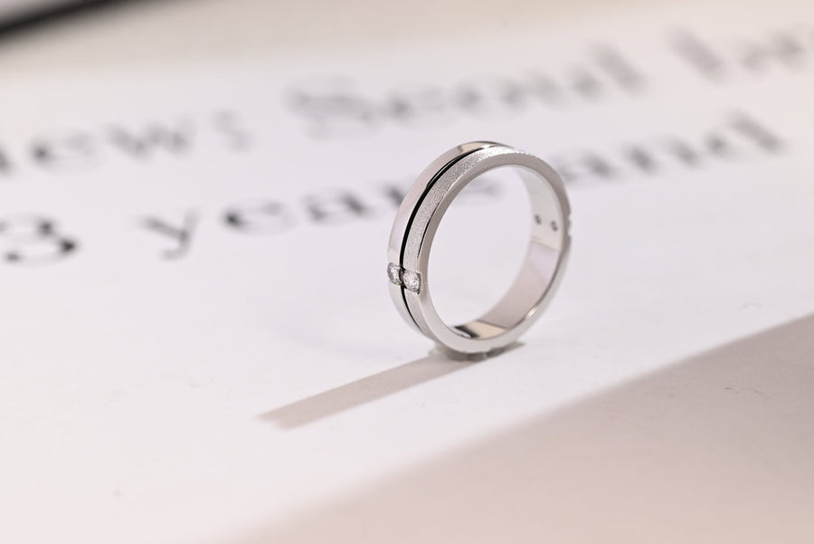 Round diamond band stacked with engagement ring