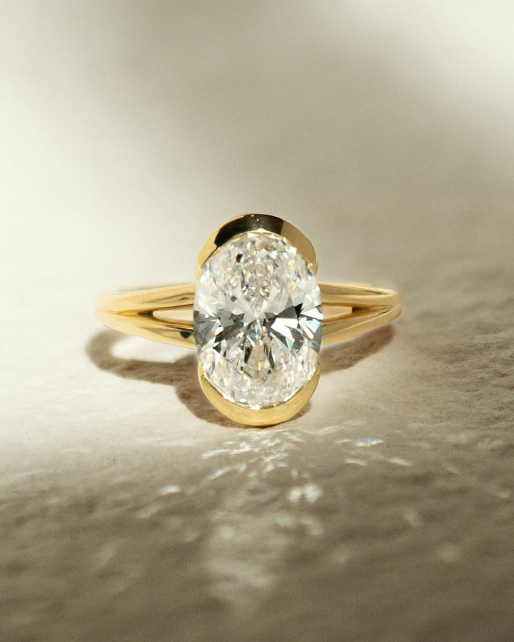 1.50 - 2.50 CT Oval Cut Lab Grown Diamond Half Bezel Engagement Ring - Doozy Diamonds