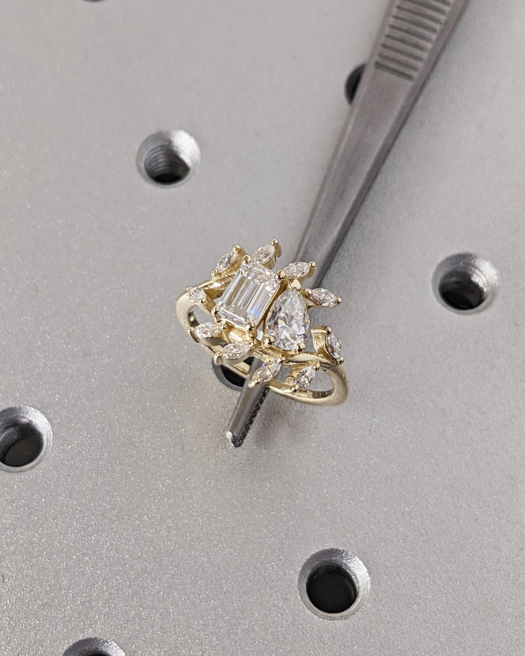 emerald cut and pear cut diamond engagement ring,