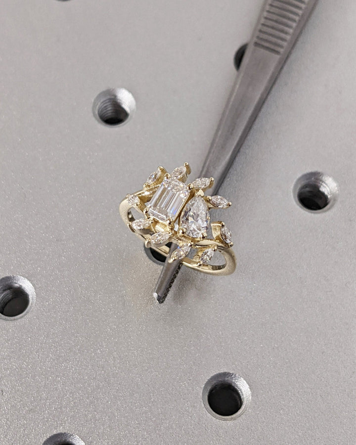 emerald cut and pear cut diamond engagement ring,