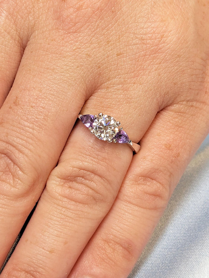 emerald cut engagement ring with cluster diamonds