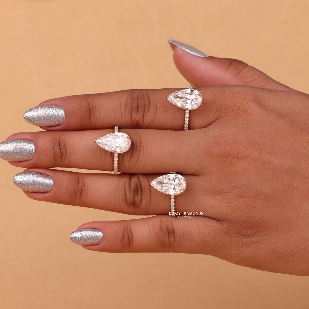 ring relationship symbol, romantic diamond proposal ring, elegant wedding proposal ring, signature bridal jewelry, luxury engagement centerpiece, pear bridal ring, glamorous hidden halo ring,