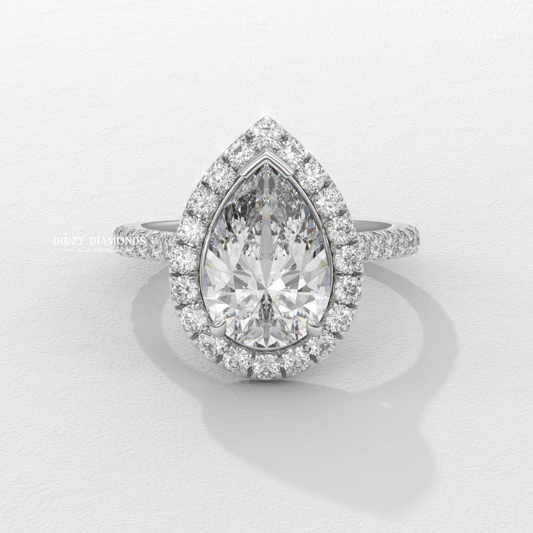 sustainable bridal ring, ethical lab diamond ring, pear cut lab diamond ring, halo wedding ring, fine jewelry engagement ring, dazzling halo ring, solitaire halo engagement ring,
