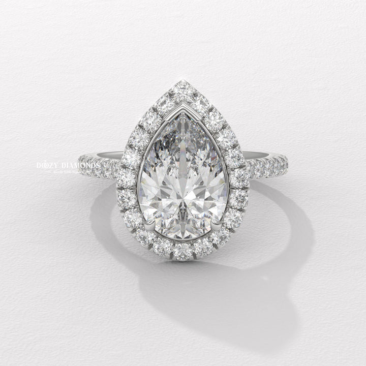 sustainable bridal ring, ethical lab diamond ring, pear cut lab diamond ring, halo wedding ring, fine jewelry engagement ring, dazzling halo ring, solitaire halo engagement ring,