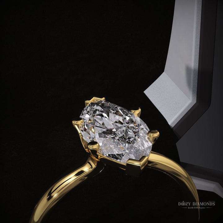 bridal jewelry ring
romantic engagement ring
timeless engagement ring
sleek diamond ring
elongated diamond ring
