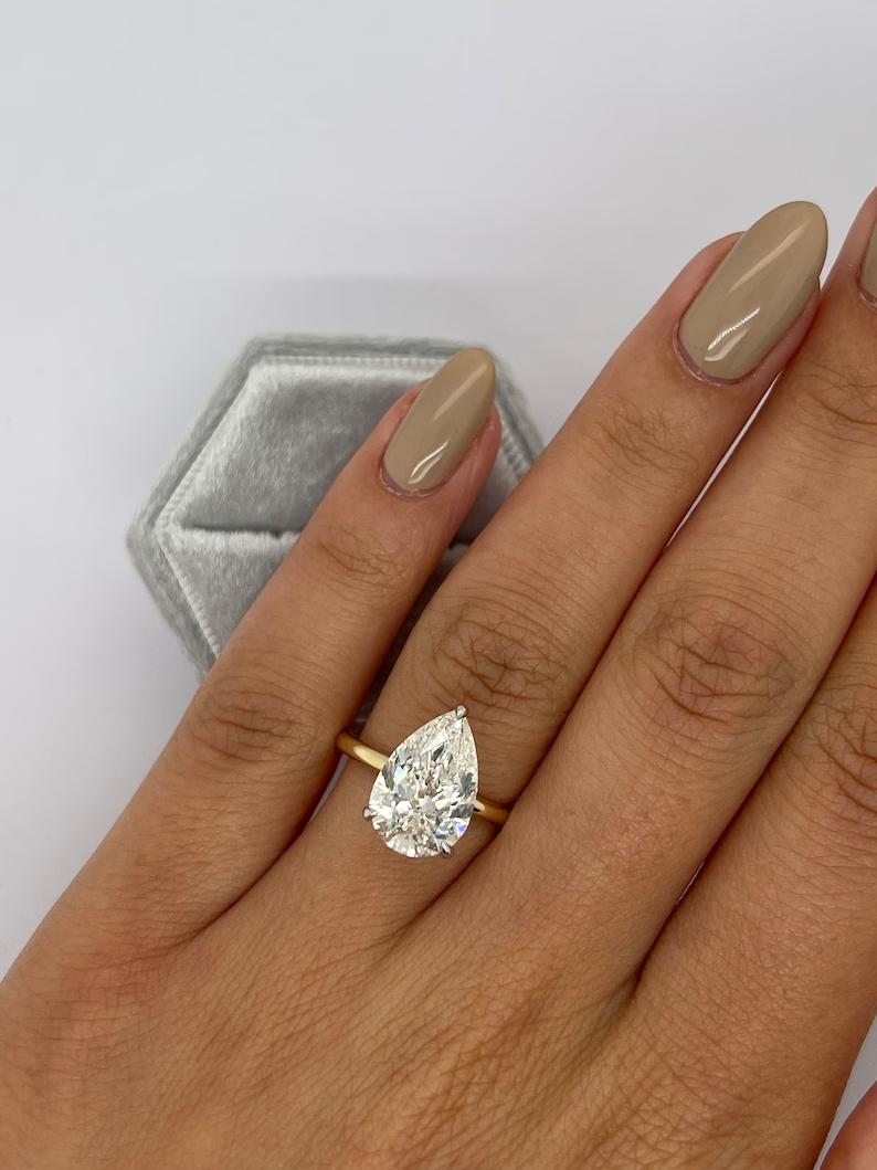 handcrafted engagement ring, luxury bridal ring, wedding ring style, refined engagement ring, premium engagement ring, fine jewelry engagement ring, sophisticated ring setting, signature engagement ring, modern bridal ring, unique bridal ring, luxury wedding ring,