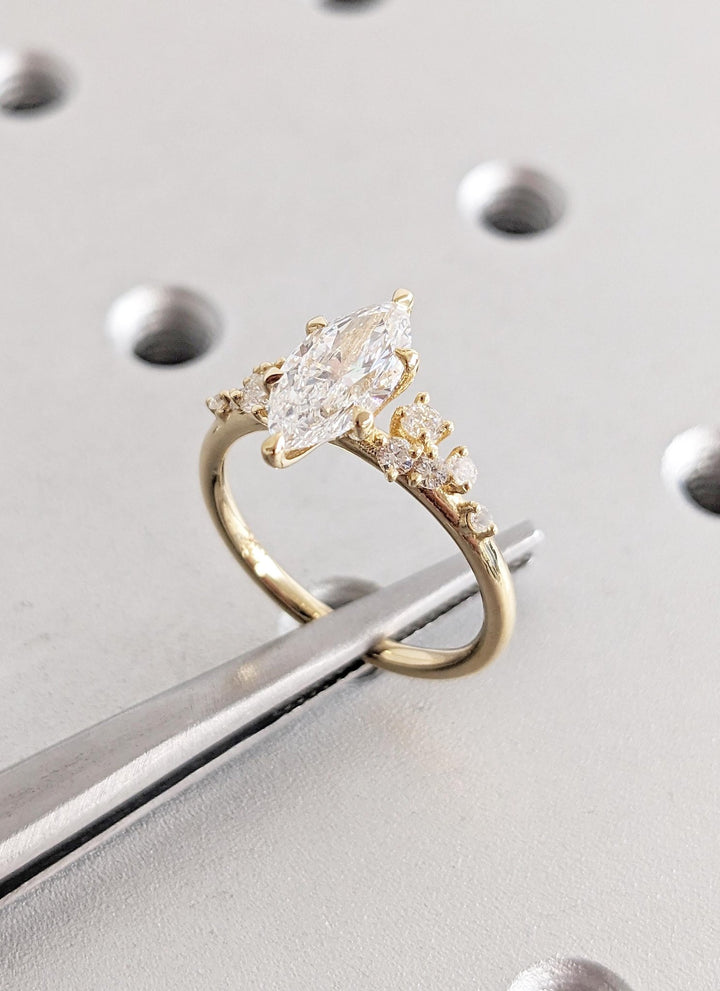 marquise cut side stone ring,