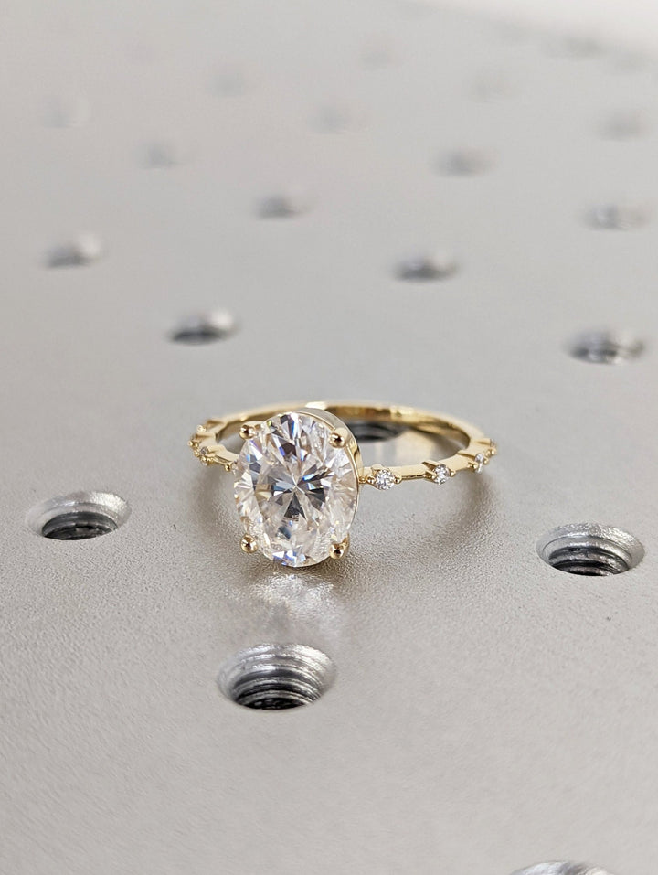 Sparkling oval diamond ring with petite pave diamonds