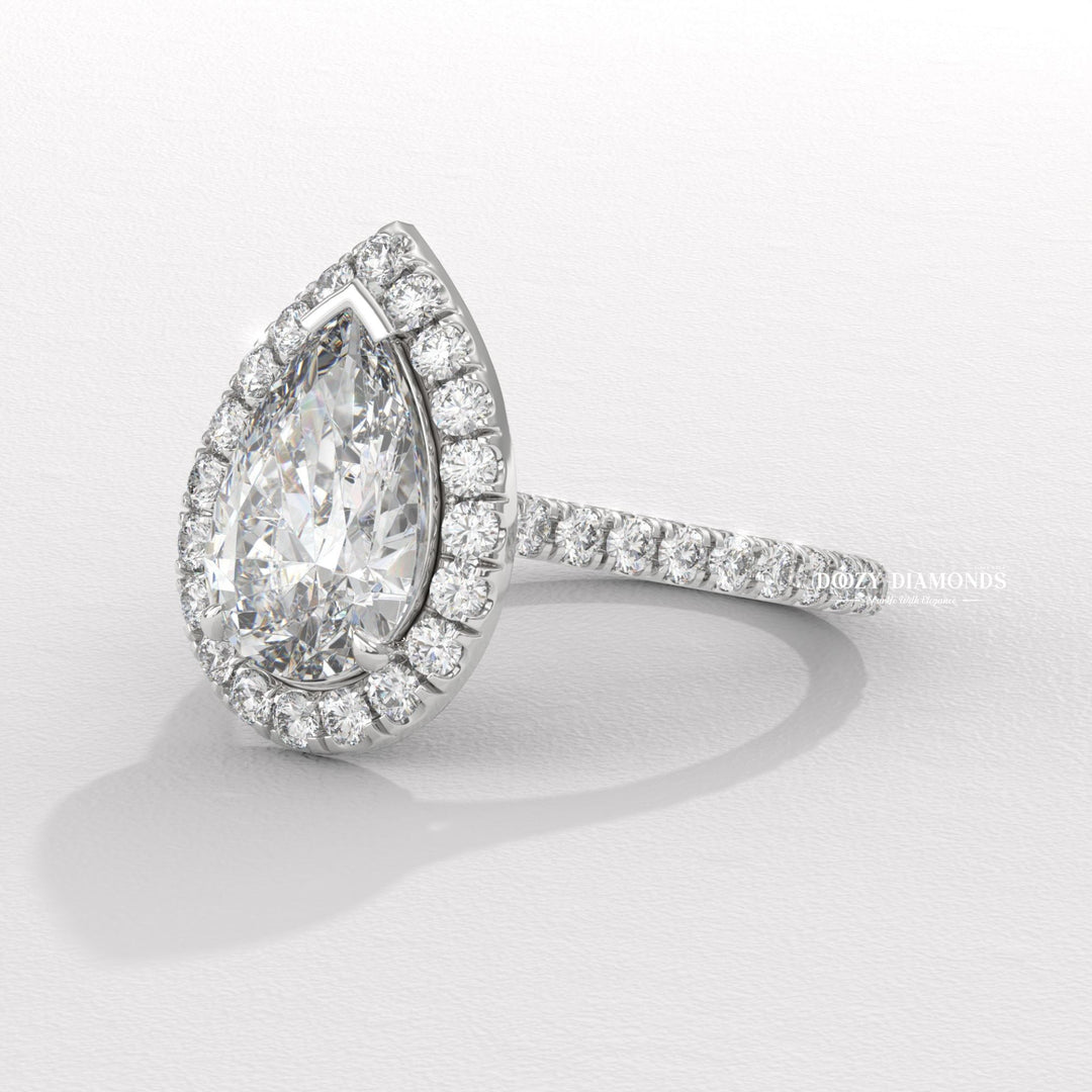 statement bridal ring, glamorous halo ring, pear halo engagement ring for women, lab grown diamond halo ring, luxury proposal jewelry, wedding jewelry for women, ethical bridal jewelry,