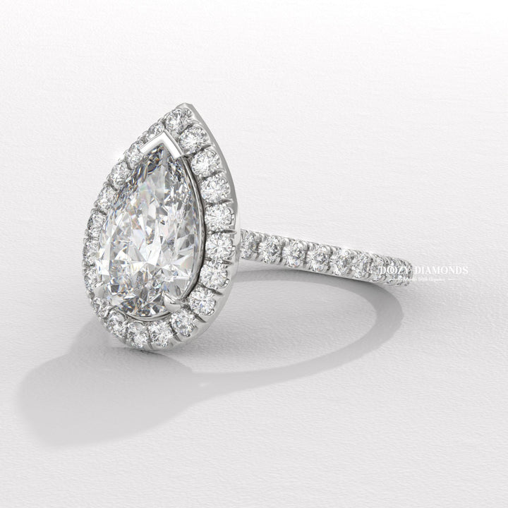 statement bridal ring, glamorous halo ring, pear halo engagement ring for women, lab grown diamond halo ring, luxury proposal jewelry, wedding jewelry for women, ethical bridal jewelry,