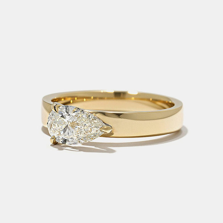 horizontal pear solitaire ring, pear proposal ring, luxury pear ring, engagement ring for her, bridal jewelry, wedding jewelry, luxury jewelry gift, modern romance ring, artisan engagement ring, handcrafted luxury ring, premium bridal jewelry, luxury romance jewelry, bridal keepsake ring,