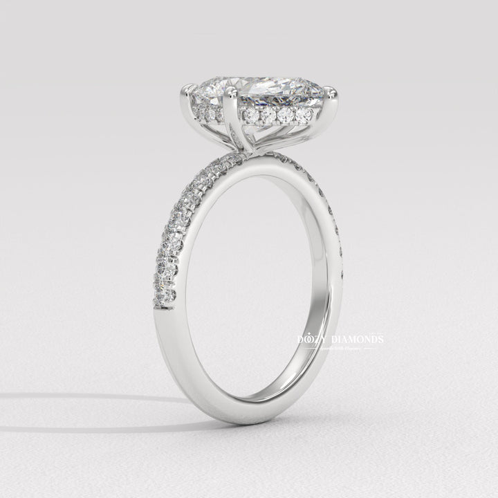 fine diamond jewelry, bridal accessories, wedding proposal ring, forever love ring, pear center stone ring, designer engagement ring, elegant bridal jewelry, luxury ring for women, engagement jewelry, sparkling bridal ring, heirloom style ring, teardrop diamond ring, unique