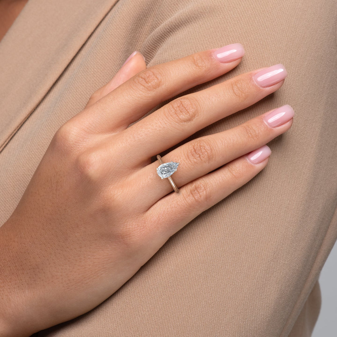 pear solitaire diamond ring,