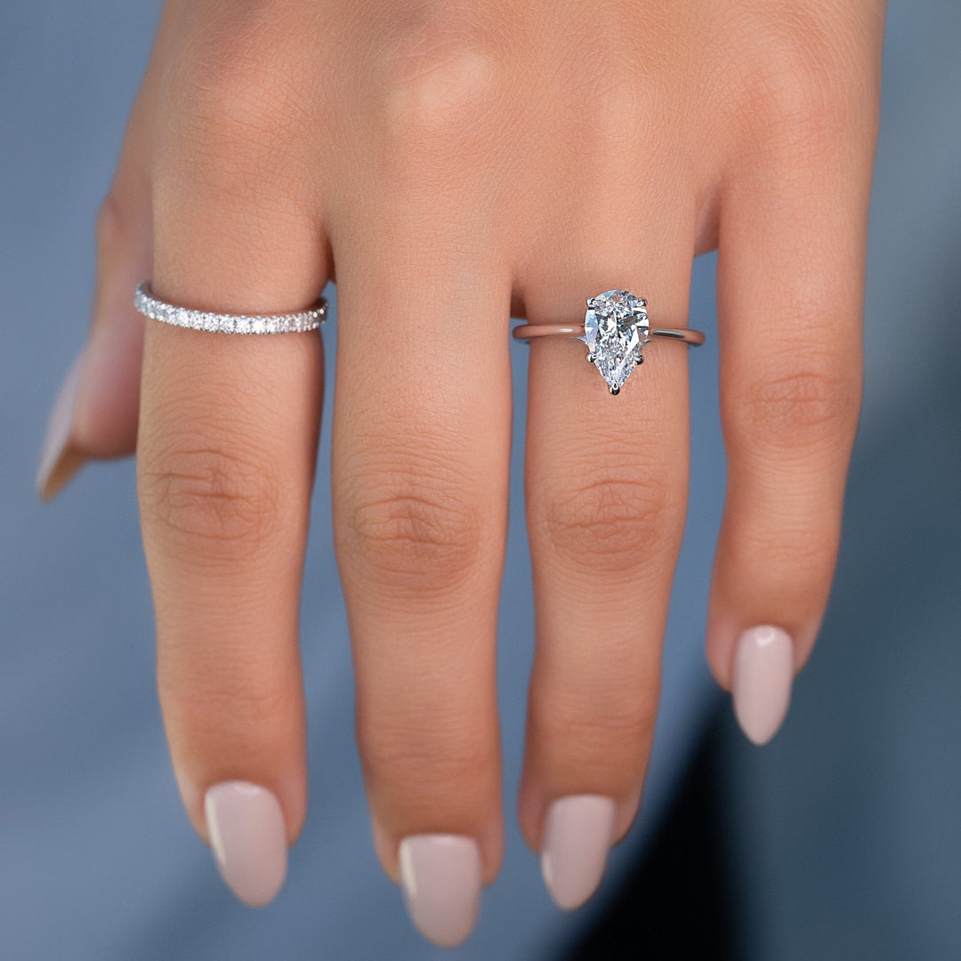 pear solitaire diamond ring,