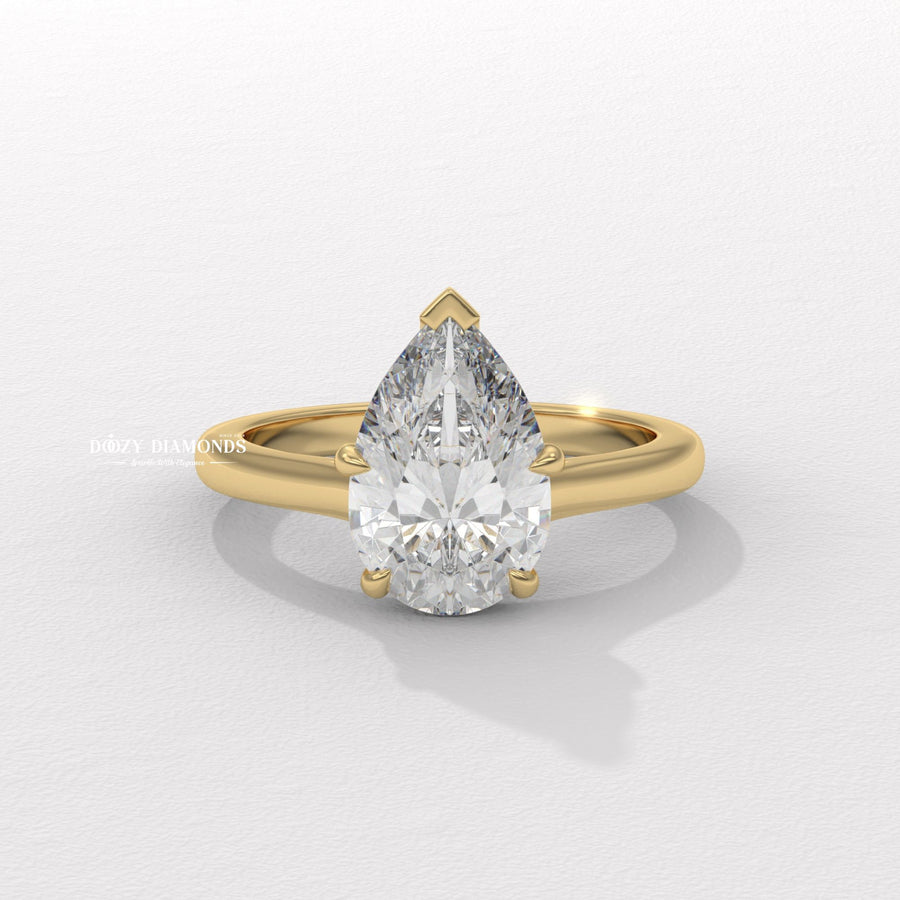 pear diamond solitaire, teardrop diamond ring, pear lab grown diamond, pear lab diamond ring, pear shape engagement ring, solitaire pear diamond ring, elongated diamond ring, luxury pear ring,