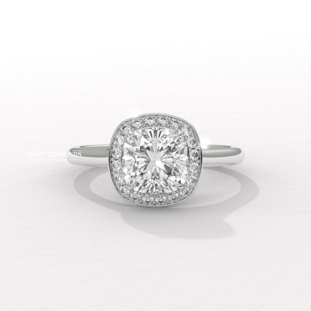 timeless bridal jewelry, cushion halo setting, halo lab diamond ring, engagement ring trends, designer bridal jewelry, statement bridal ring, glamorous halo ring, cushion halo engagement ring for women,