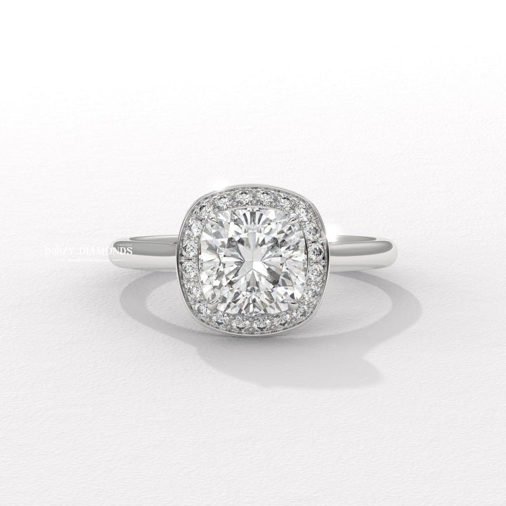 timeless bridal jewelry, cushion halo setting, halo lab diamond ring, engagement ring trends, designer bridal jewelry, statement bridal ring, glamorous halo ring, cushion halo engagement ring for women,