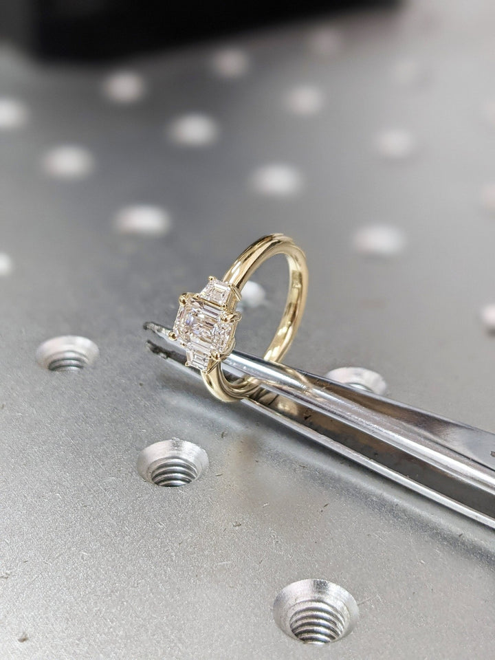 emerald cut hidden halo ring