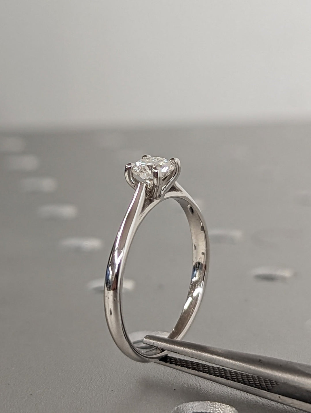 Classic solitaire engagement ring with round lab diamond
