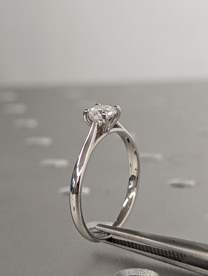 Classic solitaire engagement ring with round lab diamond
