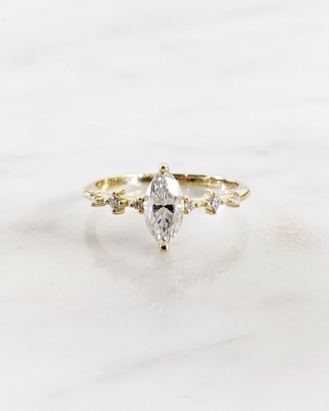 Luxury bridal ring with marquise diamond centerpiece