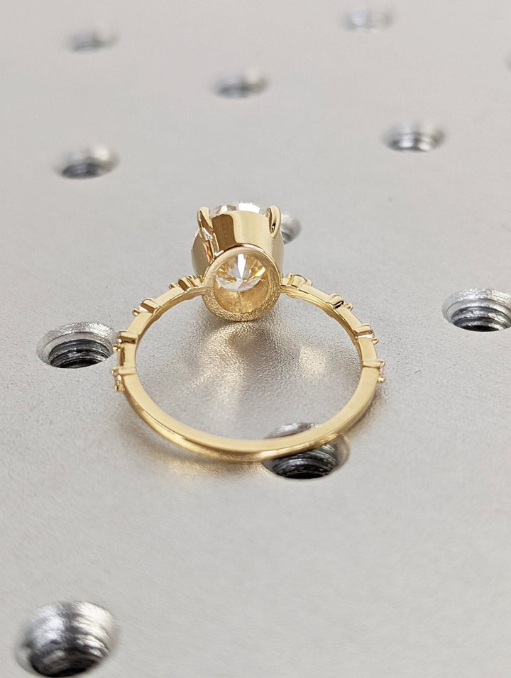 Sophisticated proposal ring with oval lab diamond