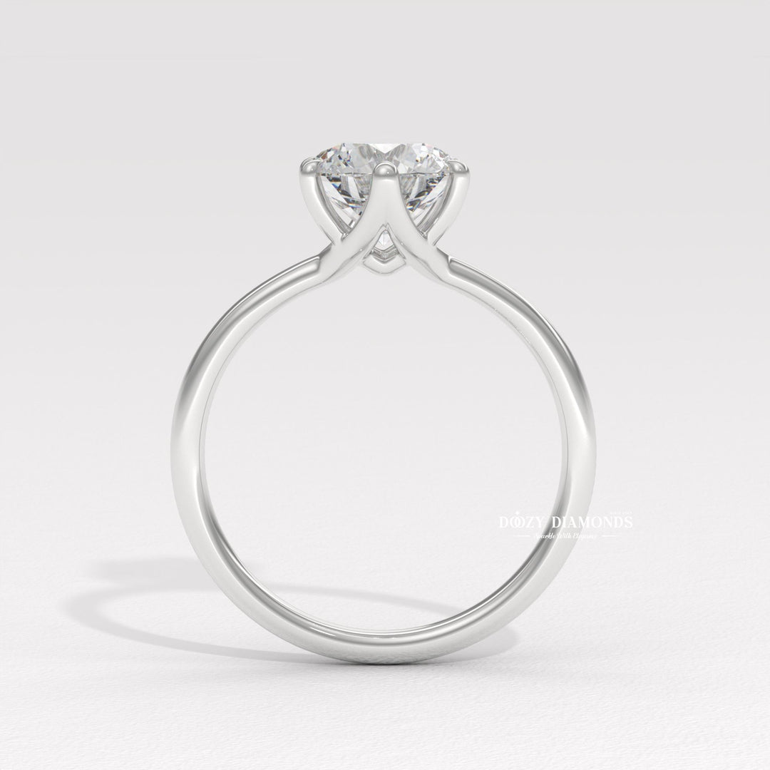 Simple Minimalist Diamond Ring
14. Timeless Round Cut Engagement Ring
15. 4-Prong Solitaire White Gold