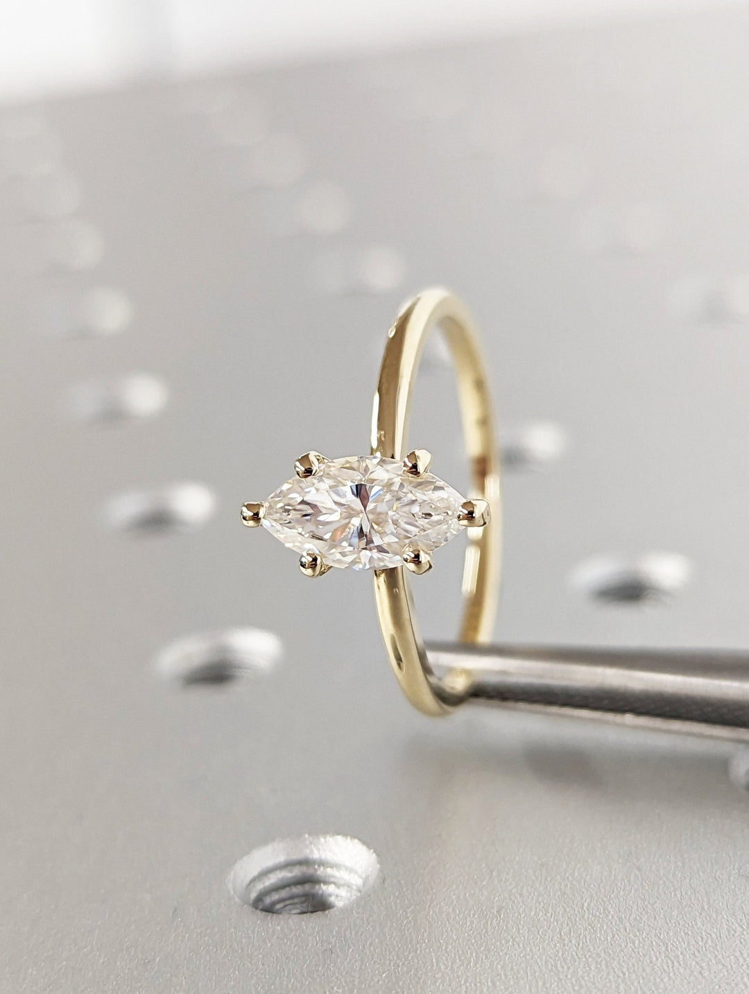 marquise cut center stone engagement ring,
