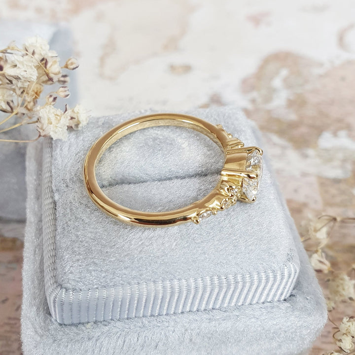 Detailed close-up of round pave diamond engagement ring