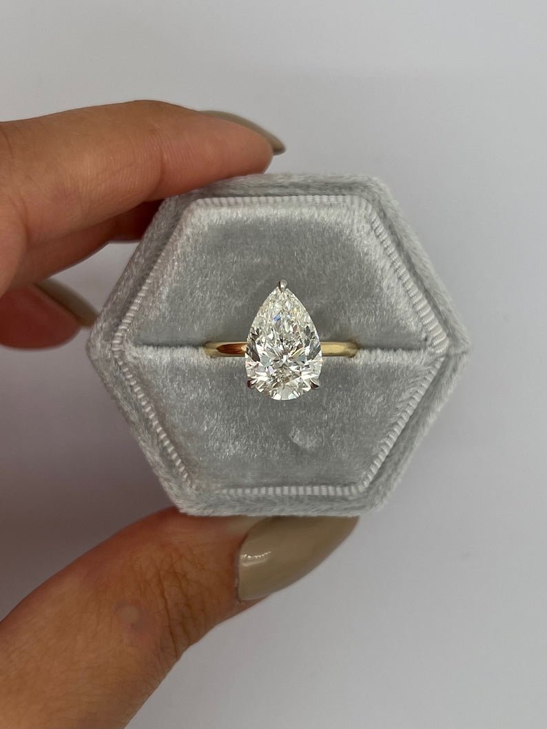 solitaire engagement ring, pear solitaire ring, classic engagement ring, minimalist engagement ring, designer engagement ring, elegant engagement ring, timeless engagement ring, luxury engagement ring, modern engagement ring, contemporary engagement ring, bridal ring, proposal ring,