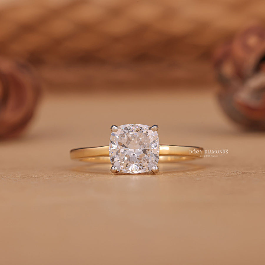 sophisticated engagement jewelry, luxury fashion ring, bridal solitaire jewelry, polished gold ring, elegant proposal jewelry, contemporary engagement style, cushion center stone ring, l