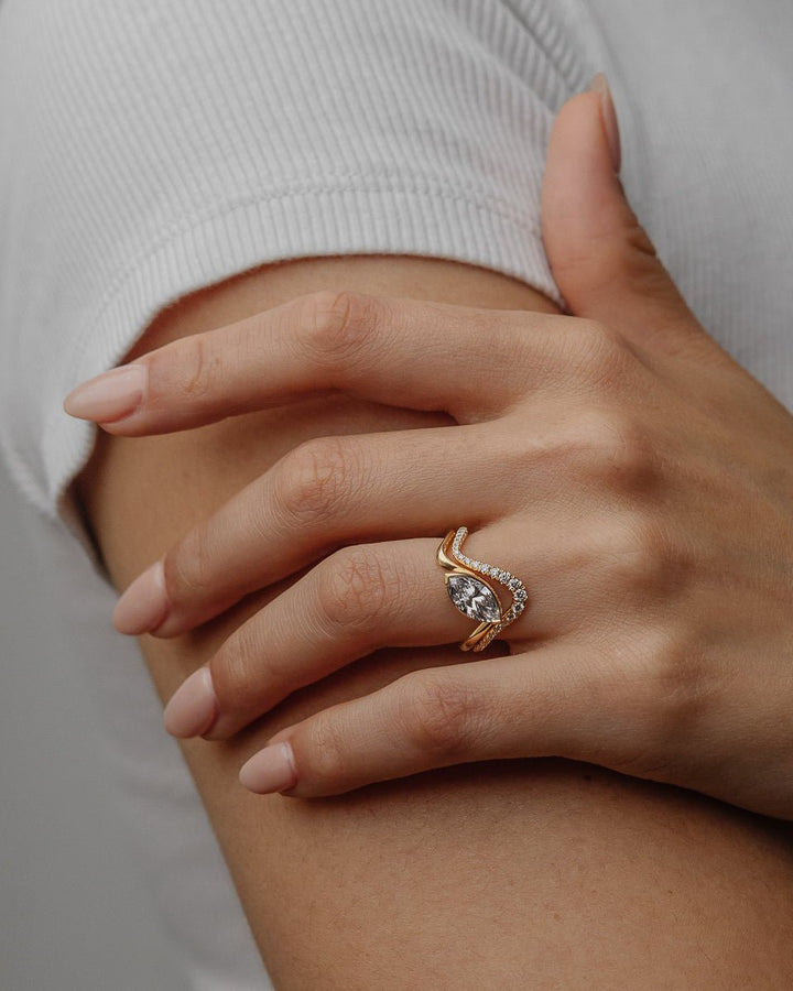 bridal solitaire ring, proposal ring, luxury bridal ring, handcrafted engagement ring, wedding ring style, contemporary engagement ring, fine jewelry engagement ring, sophisticated ring setting,