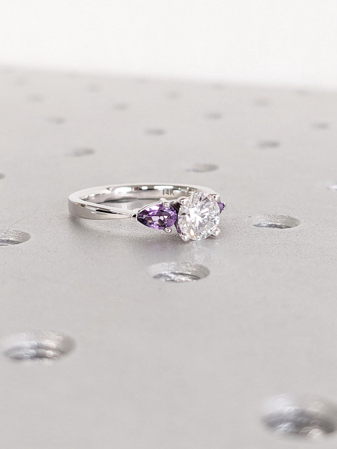 emerald cut engagement ring with accent diamonds