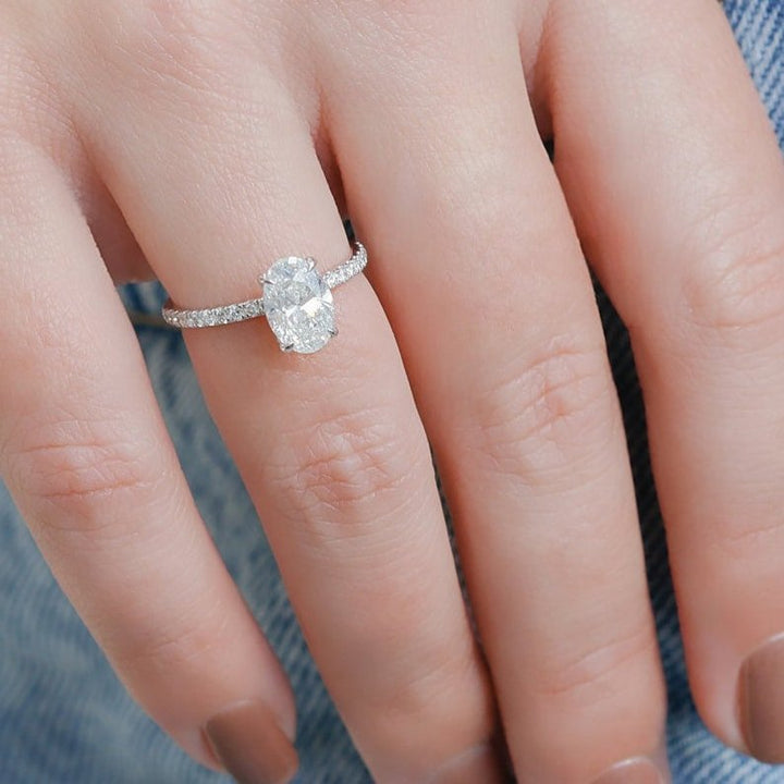 Oval hidden halo lab grown diamond ring fitted on finger