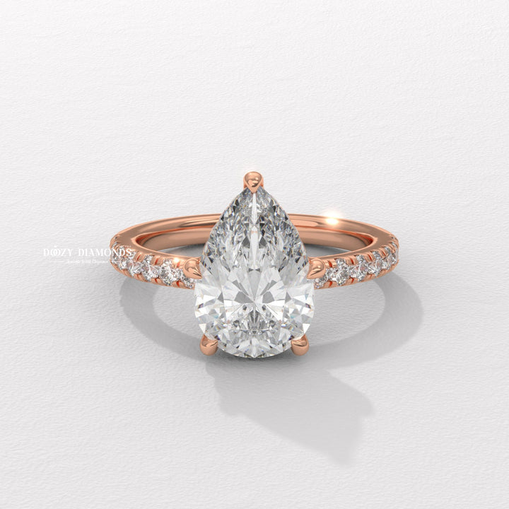 bridal diamond ring, sustainable jewelry, ethical jewelry, luxury diamond ring, timeless bridal jewelry, pear shape engagement ring, diamond ring for women, sophisticated diamond ring