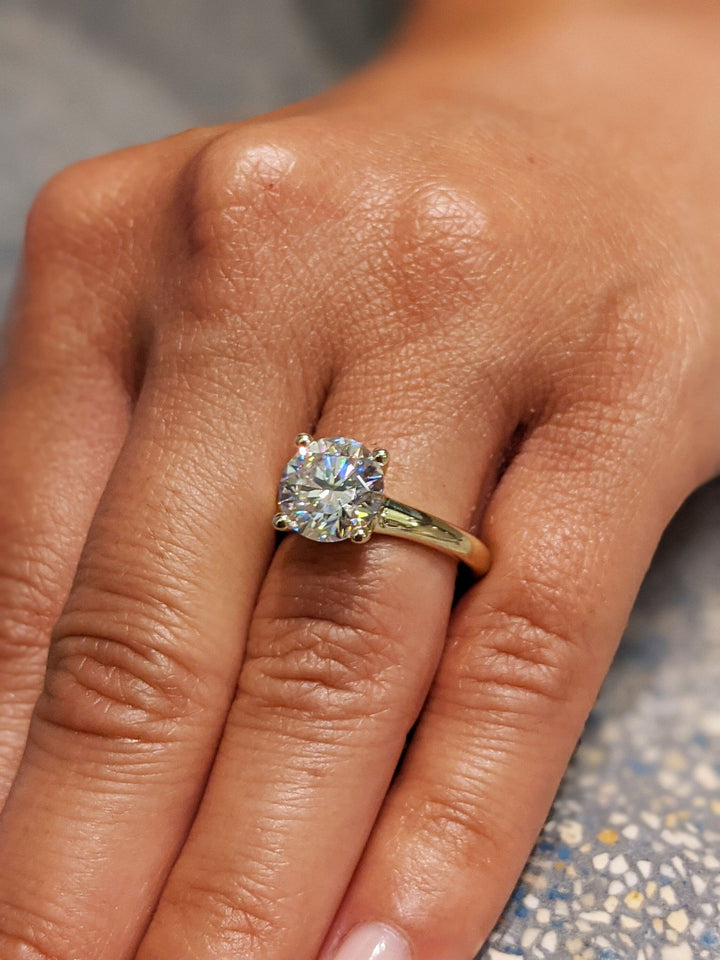 Women's fine diamond jewelry ring with round cut stone
