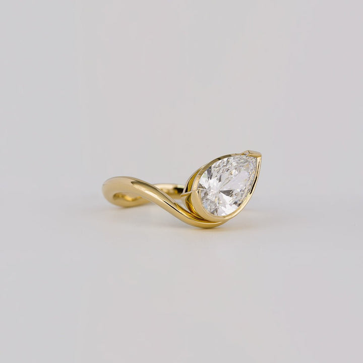eco conscious jewelry, lab grown bridal ring, lab grown wedding ring, lab grown solitaire ring, lab grown pear ring, premium lab created diamond ring, fine lab grown jewelry, handcrafted lab diamond ring,