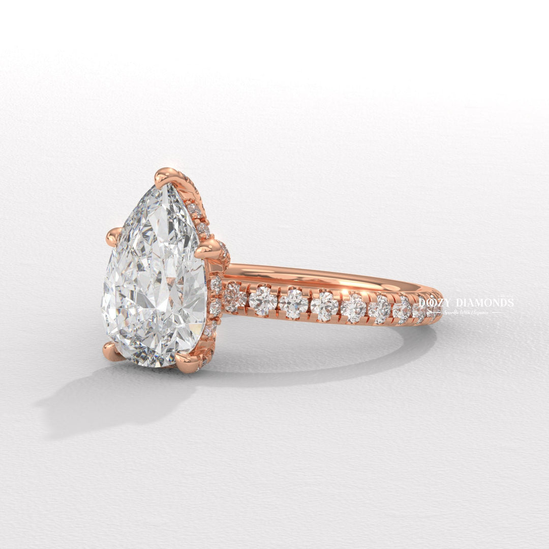 classic solitaire ring, pear diamond solitaire, solitaire engagement ring, micro pave diamond ring, french pave ring, shared prong pave ring, split shank engagement ring, twisted band ring,