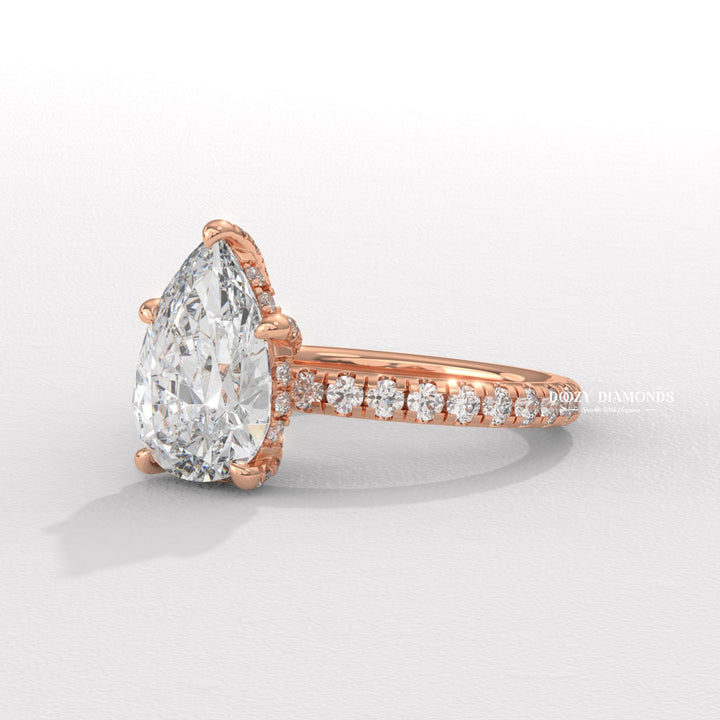 classic solitaire ring, pear diamond solitaire, solitaire engagement ring, micro pave diamond ring, french pave ring, shared prong pave ring, split shank engagement ring, twisted band ring,