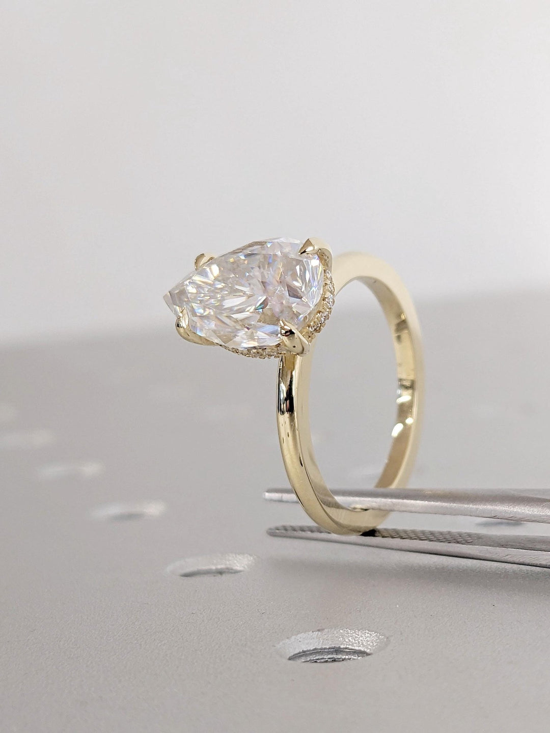 romantic bridal ring with pear diamond,