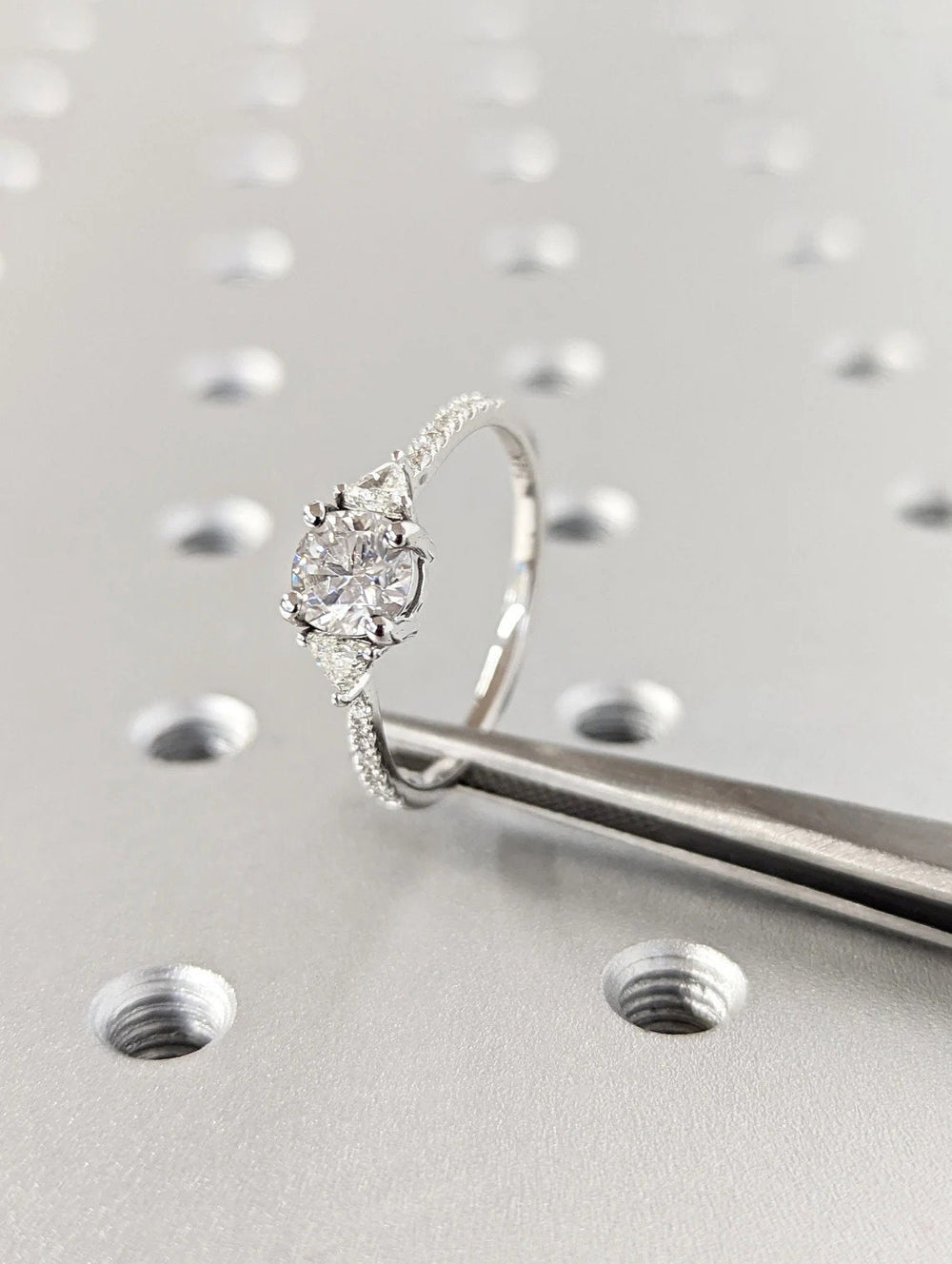 round brilliant three stone diamond engagement ring,