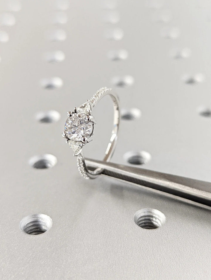 round brilliant three stone diamond engagement ring,