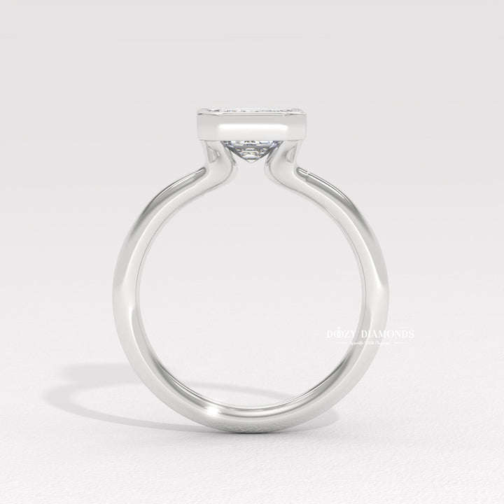 fine diamond jewelry, emerald center stone ring, minimalist engagement ring, contemporary bridal jewelry, artisan crafted ring, luxury statement jewelry, bridal keepsake ring, elegant wedding