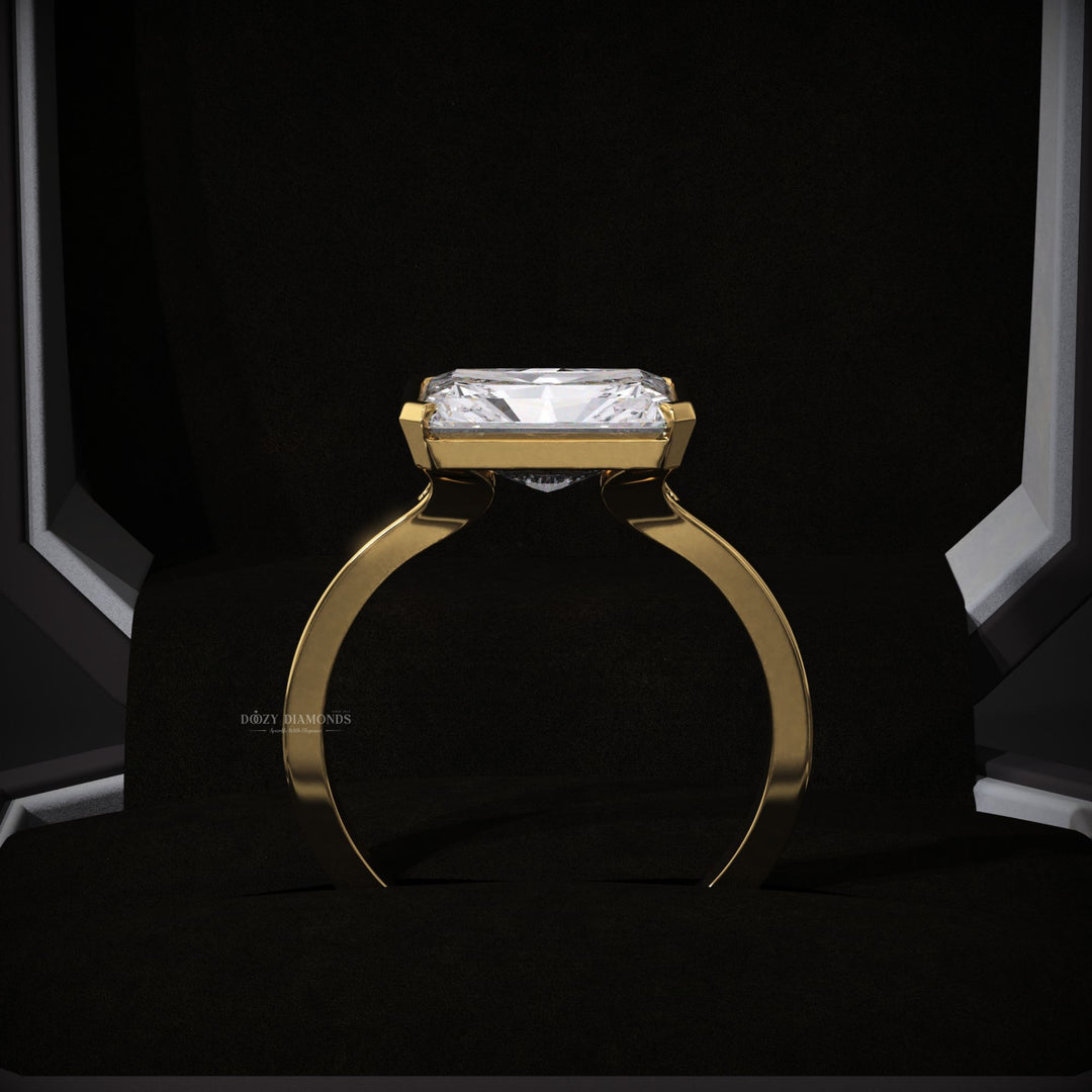 women’s diamond ring
elegant proposal ring
contemporary bridal jewelry
east west radiant ring
yellow gold bridal ring