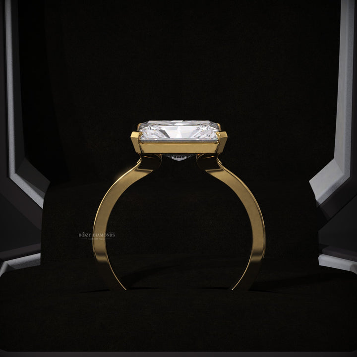 women’s diamond ring
elegant proposal ring
contemporary bridal jewelry
east west radiant ring
yellow gold bridal ring