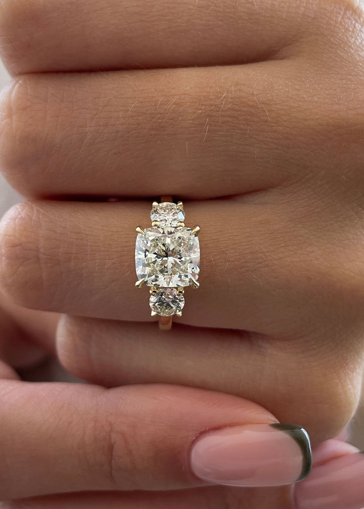 cushion G VS2 diamond trilogy engagement ring,