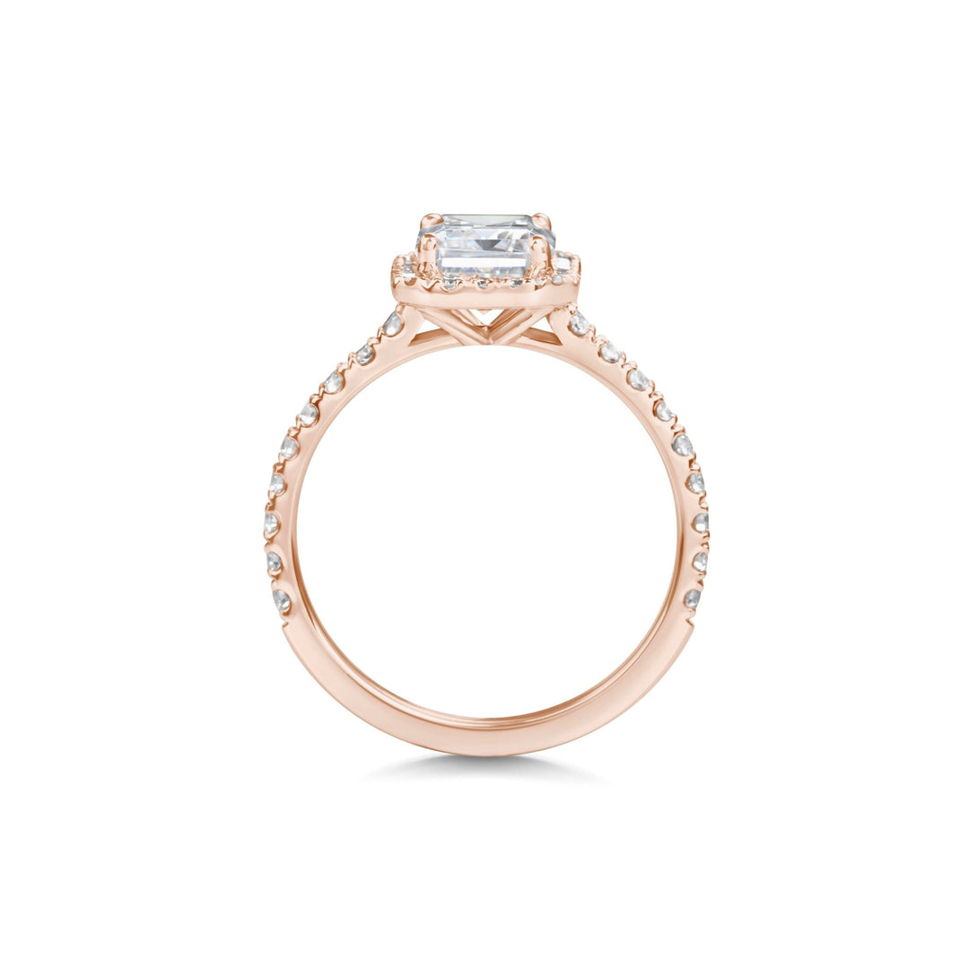 emerald center stone halo ring,