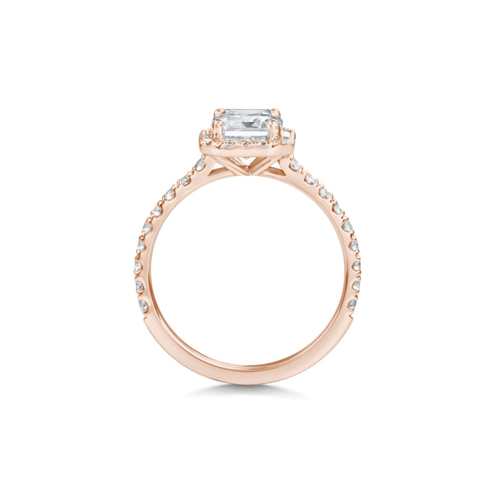emerald center stone halo ring,