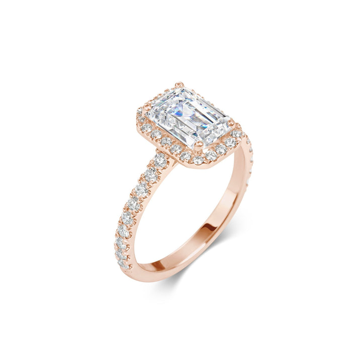 emerald diamond engagement ring with pave band